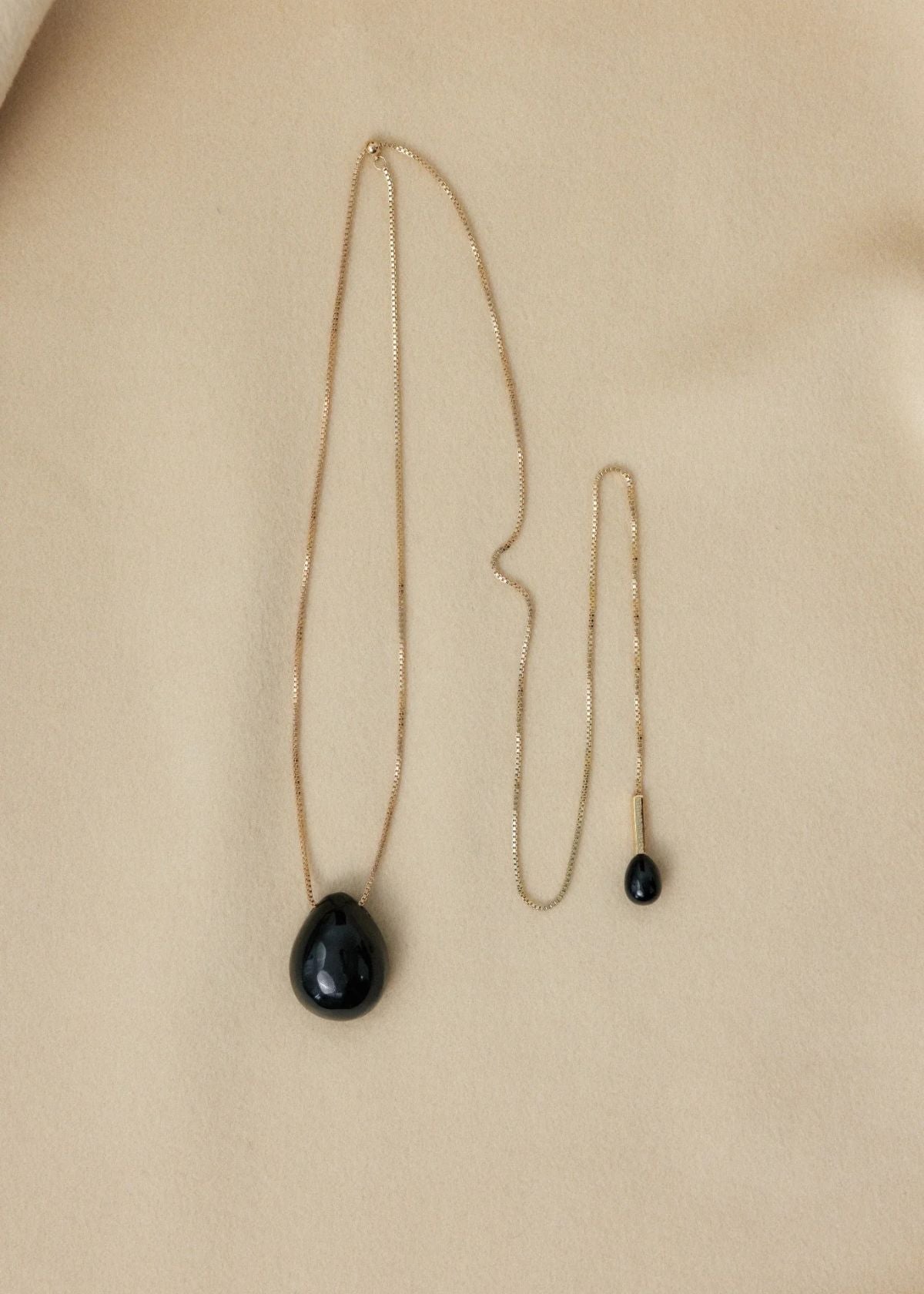 STELLAR WHISPERS Lumi Pendant Necklace - Obsidian Gold