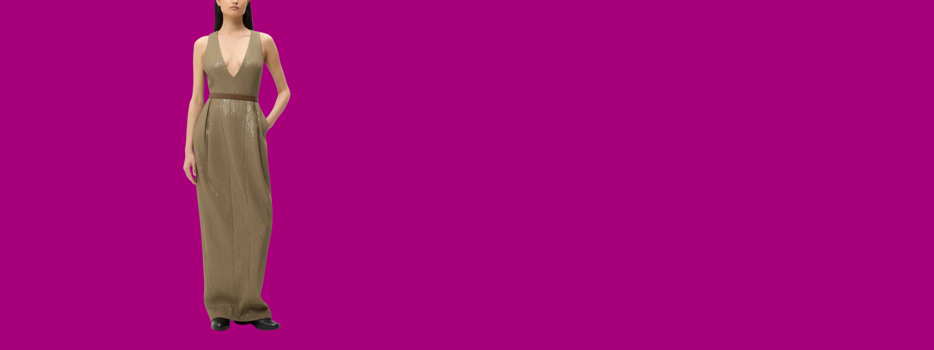 Woman wearing a long beige dress on a pink background