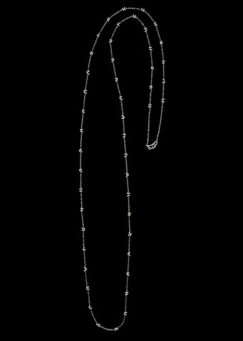 TENTHOUSANDTHINGS Sterling Silver Luxe X Necklace on Dark Silver